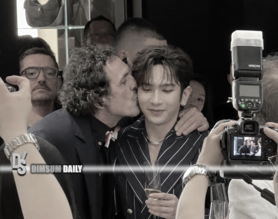 Westwood widower Andreas Kronthaler’s handhold and cheek‑kiss for Anson Lo in Macao