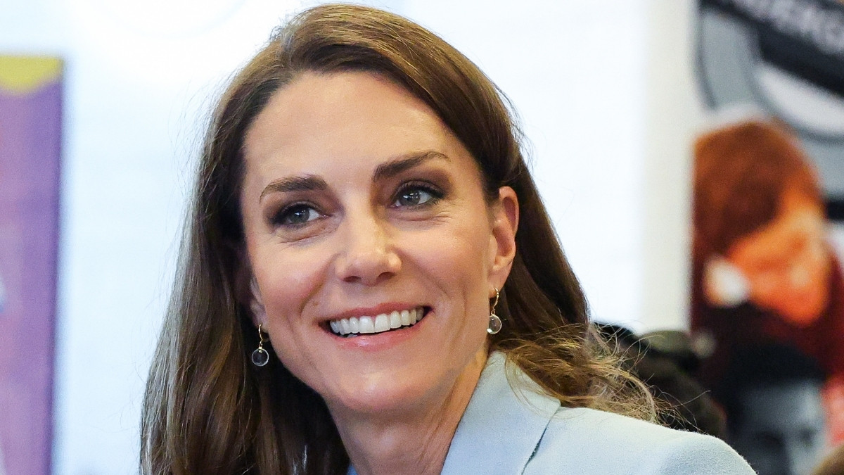 Kate Middleton in blue and brown tailoring for engagement on her 15th wedding anniversary